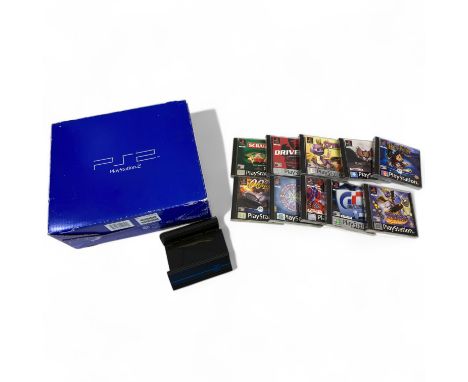 A Sony PlayStation 2 (PS2) games console, boxed with two controllers, together with a large quantity of PSX and PS2 games (qt