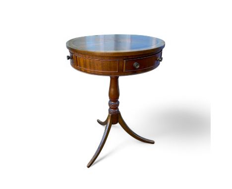 A regency style mahogany drum table with three active drawers on a turned column and splayed tripod base, 54cm diameter, 74cm