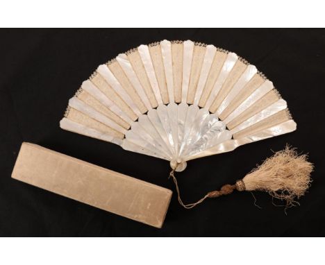 An Unusual Circa 1880's White Mother-of-Pearl Fan, the monture overlaid à la Sultane, lightly engraved, the alternating cream
