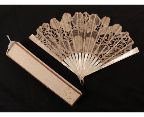 An Early 20th Century White Mother-of Pearl Fan, mounted with a light and airy tape lace leaf, with complex fillings, and bri