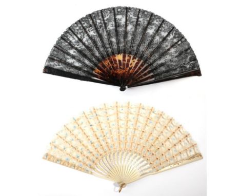 A Good Black Bobbin Lace Fan, both the monture and the ribs of tortoiseshell, the leaf designed with a large spray of flowers