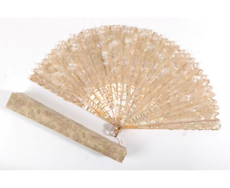 An Early 20th Century Fan, the monture of pink mother-of-pearl, the bone ribs overlaid with a light and airy bobbin lace leaf