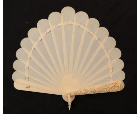 A Circa 1870's to 1880's Ivory Brisé Fan, of fontange form, the fifteen inner sticks plain, the upper guard elaborately carve