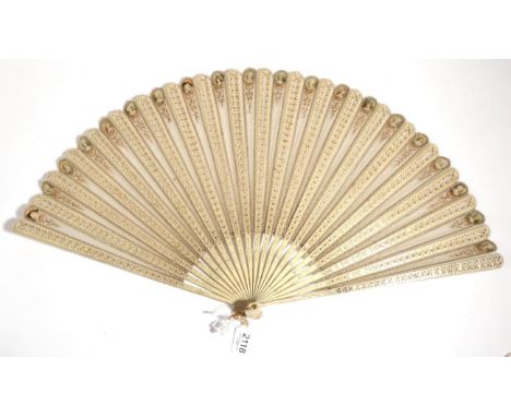 A Large Late 19th Century Wooden Fan, with a very light and airy appearance, the monture painted cream , the wood carved and 