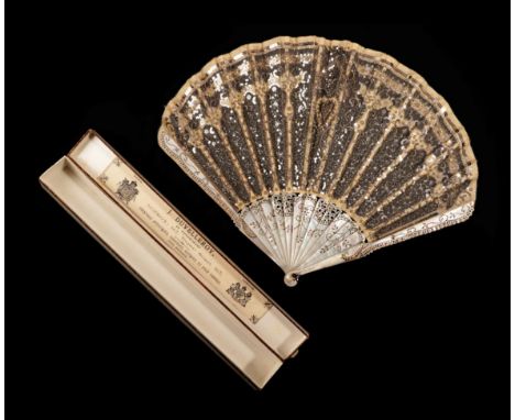 An Elegant Circa 1900 Fan, the silver gauze leaf of palmette form, applied with a strong ivory net and ivory silk and lavishl