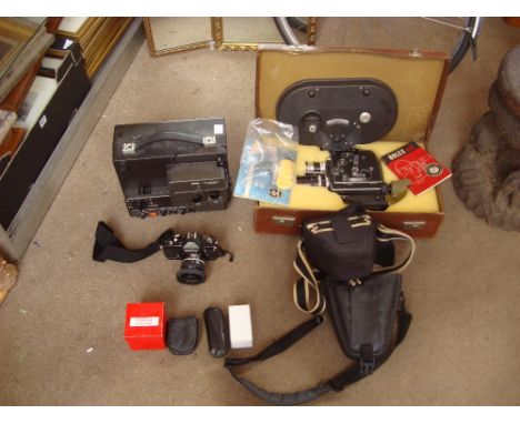 A Bolex H16 Reflex cine camera with original instructions in leather suitcase with a Nikon Nikkomat 35mm SLR camera and a Bau