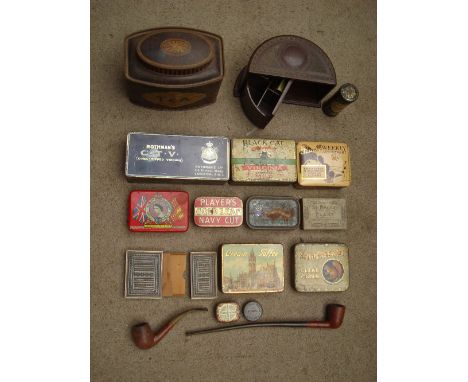 A selection of 20th Century tins including a G Bassett tea caddy, Black Cat cigarettes etc with a swivelling Bakelite smokers