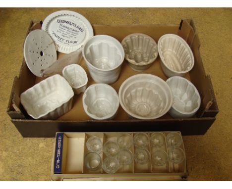 Kitchenalia. Ceramic moulds (8) and a Brown and Polsons plate, a glass Boots feeder. 