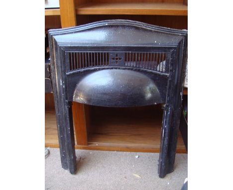 A painted childs chair, three carborundum blocks, an iron fire surround, a small flower press. 