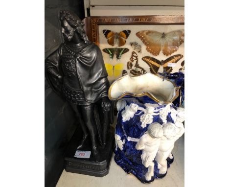 Moulded relief pottery jug and painted ceramic figure 