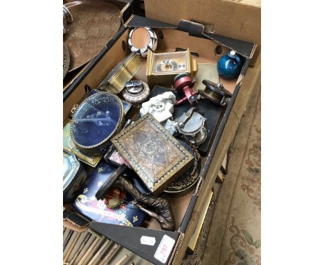 A box of bric a brac including clock, trinket boxes, table lighter, fishing reels etc 