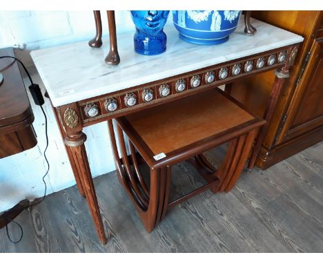 A reproduction French style marble top console table with gilt metal mounts, enamel panels and fluted legs. 