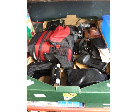 A box of cameras and camera accessories 