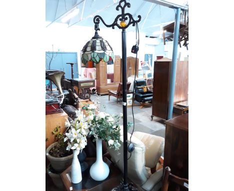 A lamp with Tiffany style shade. 