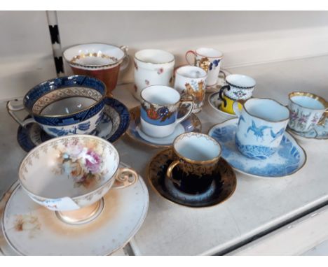 A collection of cups and saucers including Noritake, Royal Doulton etc 
