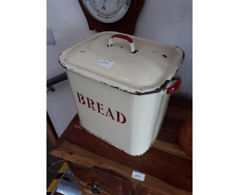 An enamel bread bin and contents. 