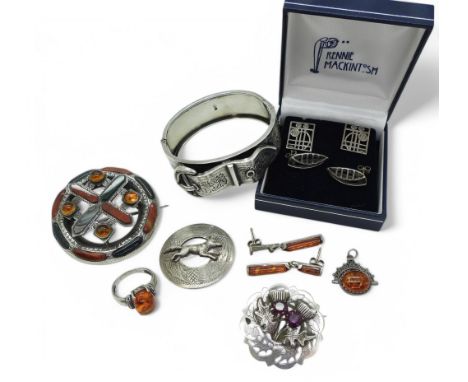 A silver bangle in the shape of a buckle with Birmingham hallmarks for 1888, a Scottish brooch inlaid with agate, a Wards bro