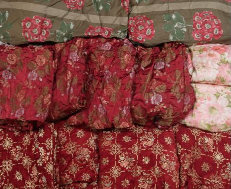A collection of floral curtains, mainly in pinks and reds Condition Report:We would recommend you view these items personally