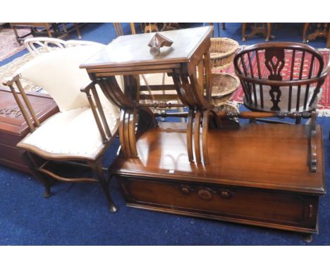 A lot comprising a 20th century cream upholstered hoop back armchair, X framed nest of three tables and a mahogany bench ches