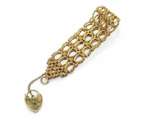 A 9ct gold fancy link gate bracelet, with heart shaped clasp, length 18cm, width 2.2cm,&nbsp; weight 14gms Condition Report:A