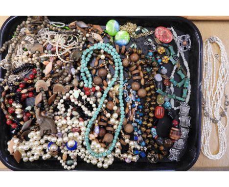 A large collection of vintage costume jewellery to include;- a string of tiger's eye beads, a string of opal panel beads, a m