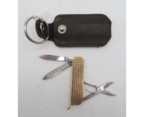 A 9ct gold pocket knife, maker's mark Ramsden &amp; Roed, London, fitted with Victorinox steel blades, measuring approx. 5.8c