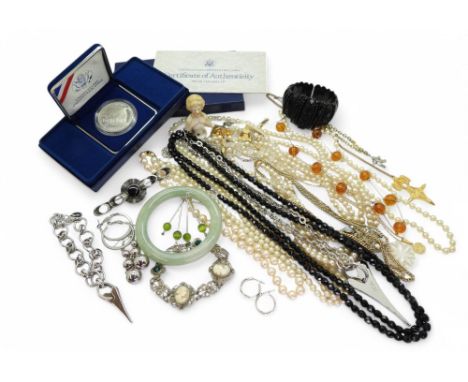 A Chinese green hardstone bangle, together with a Whitby jet bracelet, a collection of costume jewellery to include a Miss De