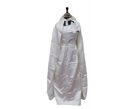 A wedding dress, cape and veil in satin with embroidery Condition Report:We would recommend you view these items personally f