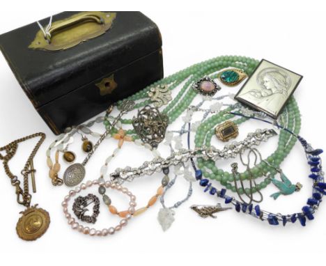 A triple string of Chinese green hardstone beads, a white metal Austro Hungarian George &amp; The Dragon pendant, a marcasite