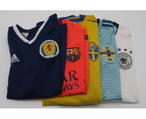 A very large collection of football and golf shirts, to include Scottish, English and German National examples, alongside Cly