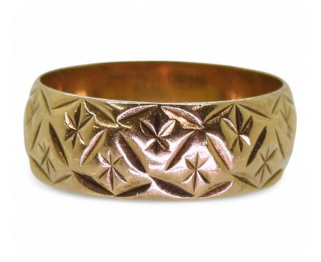 A 9ct gold retro star engraved wedding ring, size&nbsp; O1/2, hallmarked London 1974, weight 3.8gms Condition Report:Availabl