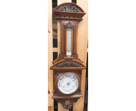 A late Victorian oak A,Dobbie &amp; Son, Glasgow aneroid barometer/thermometer, 103cm high Condition Report:Available upon re