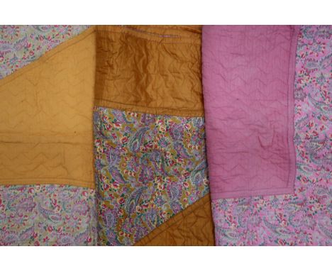 A 1930s/40s Comfy quilt with central paisley diamond with pale orange surround, the other side in reverse,&nbsp; 214cm x 170c