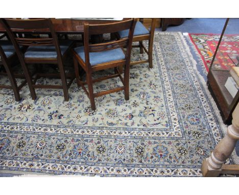 A LATE 20TH CENTURY PERSIAN LIGHT GREEN GROUND CARPET with a banded border and geometric foliate decoration, 378cm x 248cm