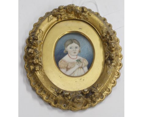 AN ANTIQUE MINIATURE PORTRAIT of a child holding a wild rose in a decorative gilt frame 7cm x 6cm 