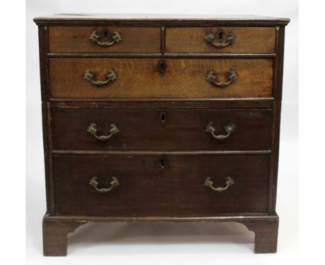 A LATE 18TH / EARLY 19TH CENTURY OAK TWO OVER THREE LONG DRAWER CHEST standing on bracket feet 110cm x 111cm x 69cm 