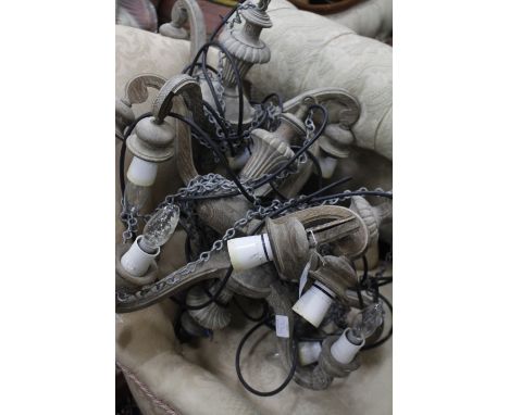 FOUR MID 20TH CENTURY LIMED OAK THREE LIGHT ELECTROLIERS, 49cm wide (4)