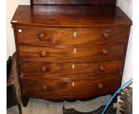 A 19TH CENTURY MAHOGANY BOW FRONTED CHEST OF FOUR LONG GRADUATED DRAWERS with turned knob handles and splay bracket feet, 103