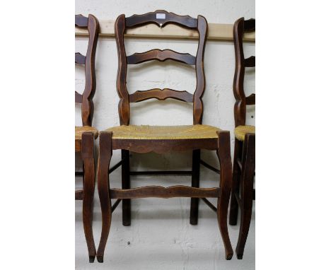 A SET OF SIX FRENCH LADDER BACK KITCHEN CHAIRS with rush seats (6)