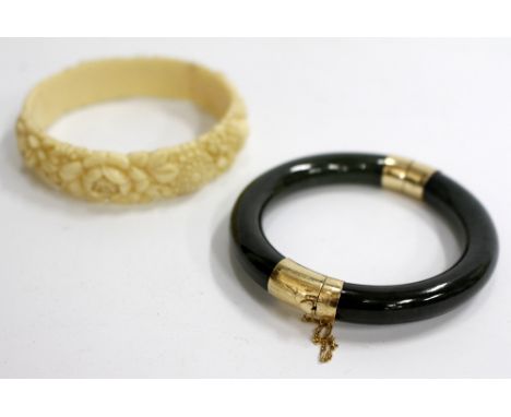 A MOTTLED JADE YELLOW METAL MOUNTED BANGLE and one other (2)