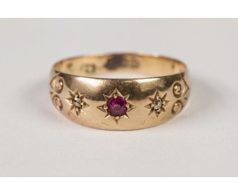 EARLY TWENTIETH CENTURY 18ct GOLD RING, gypsy set with a small centre ruby flanked by two tiny rose cut diamonds, Chester hal