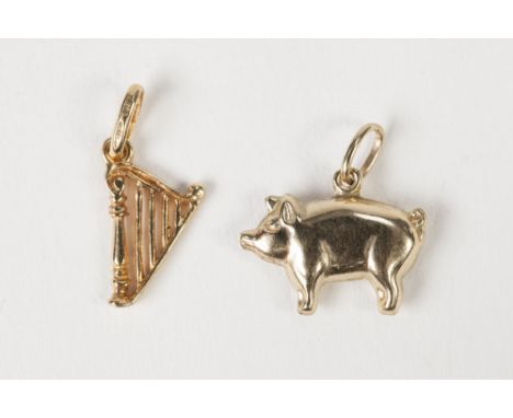9ct GOLD CHARM in the form of a harp and a GOLD COLOURED METAL PIG CHARM (2) 