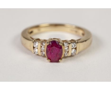 18ct GOLD, RUBY AND DIAMOND RING, with a centre four claw set oval ruby, the shoulders each set with five small diamonds, 5.3