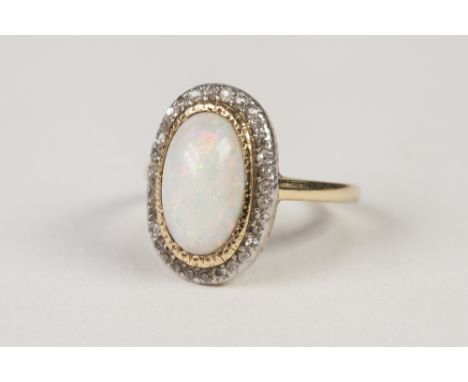 GOLD (UNMARKED) OPAL AND DIAMOND CLUSTER RING set with a centre oval opal and surround of 32 tiny diamonds, 4.1 gms