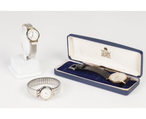 GARRARD, LONDON GENTS WRIST WATCH with Swiss mechanical movement, in gold coloured metal presentation case, the circular silv