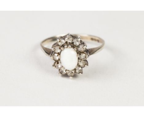 SILVER, OPAL AND WHITE STONE OVAL CLUSTER RING, with centre oval opal and surround of white stones 
