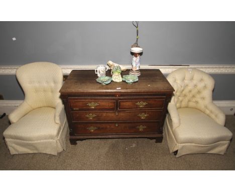 Two 20th century Victorian style cream button back upholstered armchairs. Each 86cm max H, 61cm W, 56cm D.