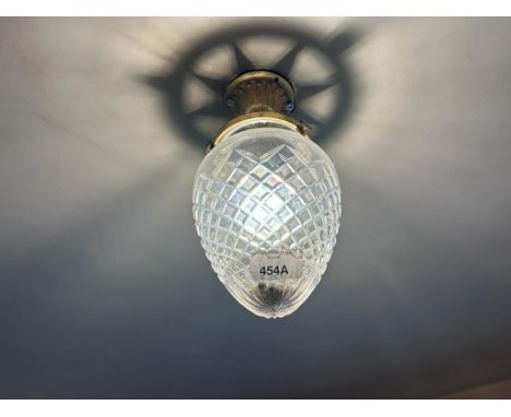 An early to mid 20th century brass and glass bullet shaped ceiling light with hobnail decoration