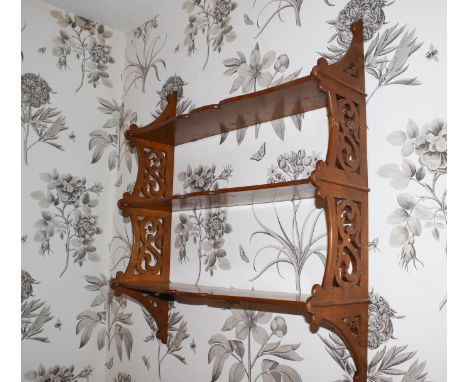 A 19th century fretted oak open wall shelf of three tiers, 78cm H, 68cm W, 21cm D