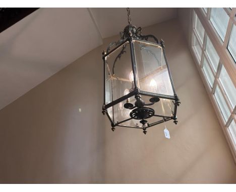 An early to mid 20th century brass and glass hexagonal wall light with acanthus and beaded decoration